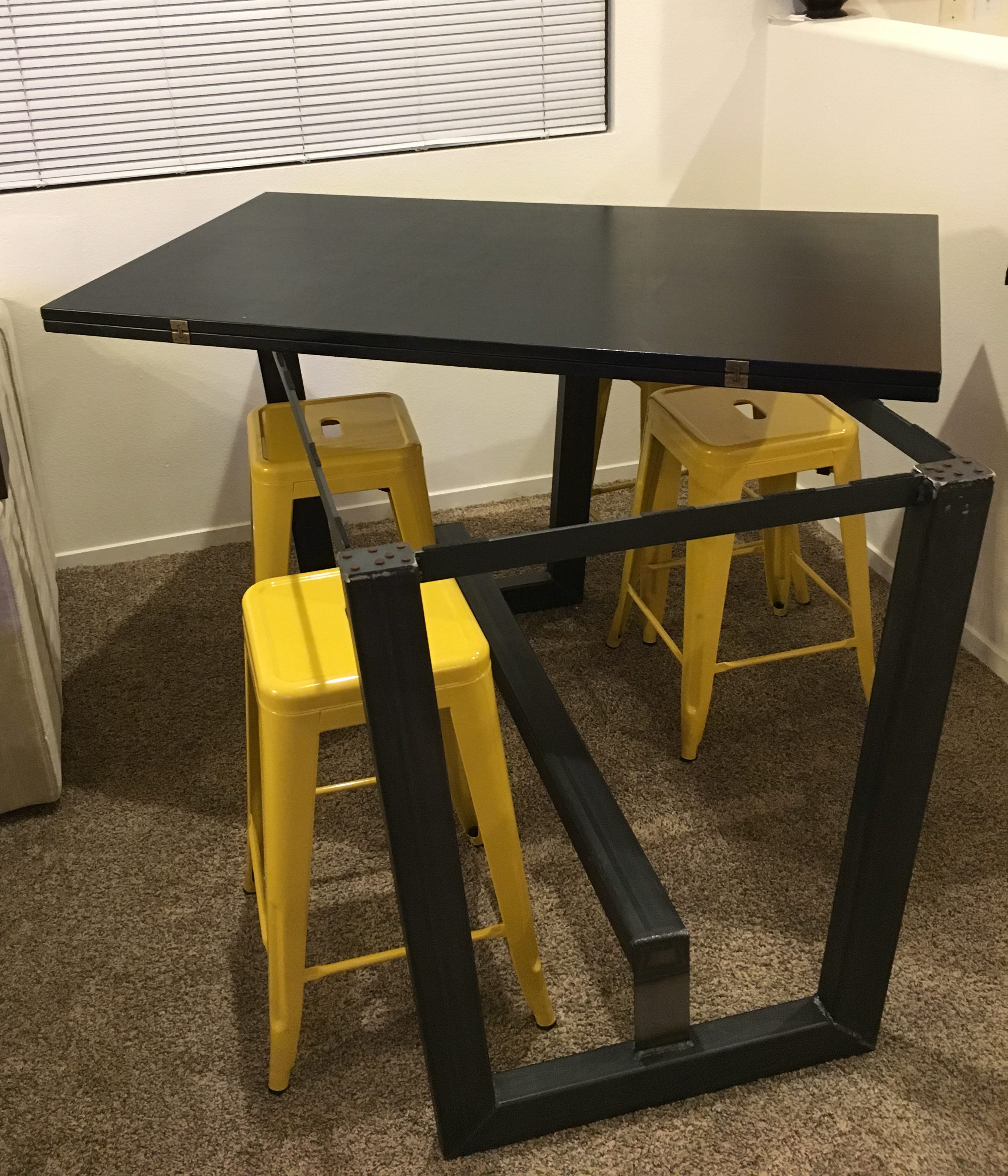 Rotating the folded table top on custom metal base.
